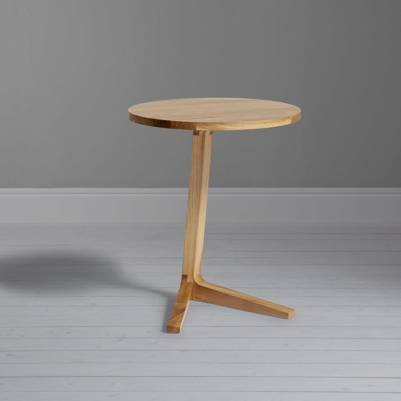Case Cross round side table in solid oak finish, UK version