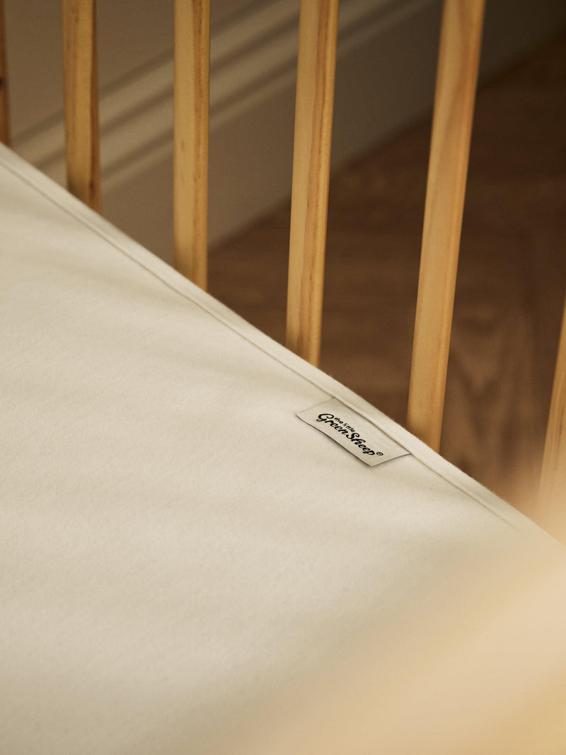 The Little Green Sheep waterproof cotbed mattress protector (British brand)