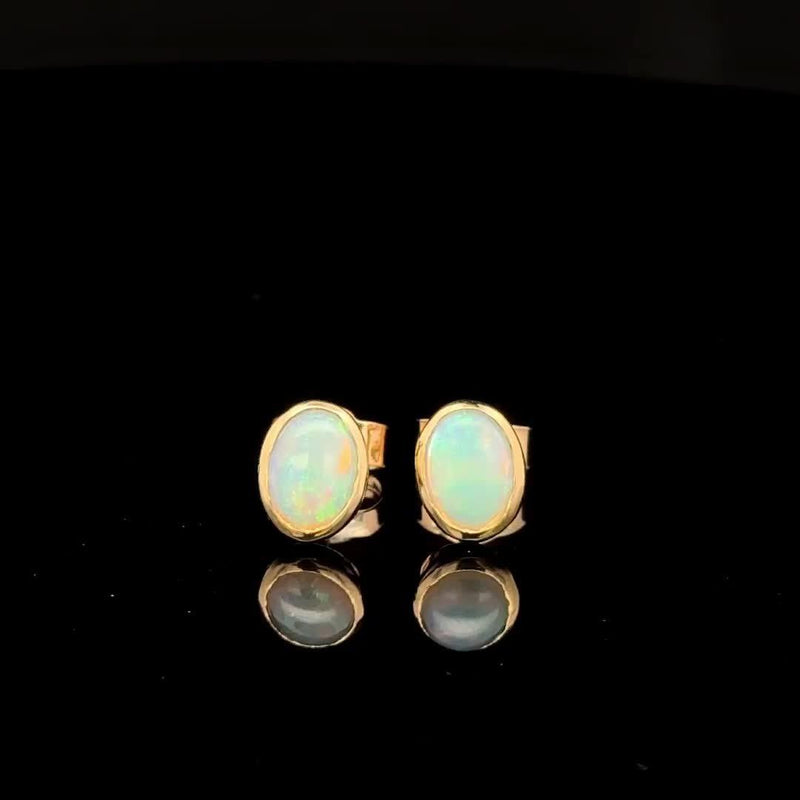 E.W Adams 9ct gold oval stud earrings with opal stone, imported from the UK