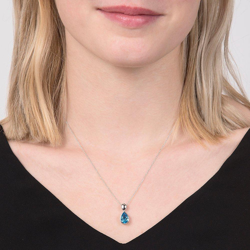 E.W Adams blue topaz pendant 9ct white gold imported from the UK