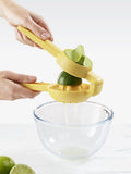 Joseph Joseph citrus press in bright yellow for juicing lemons and limes, UK version