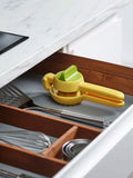 Joseph Joseph citrus press in bright yellow for juicing lemons and limes, UK version