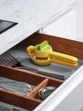 Joseph Joseph citrus press in bright yellow for juicing lemons and limes, UK version