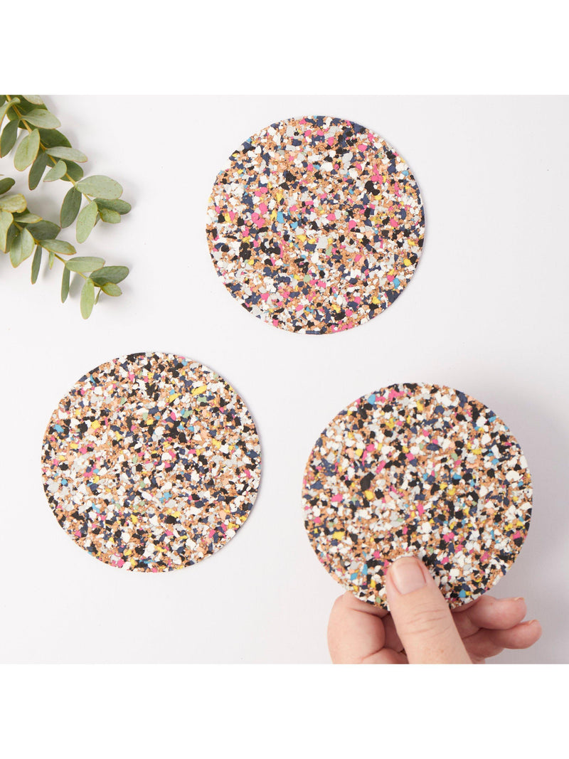 Set of four round cork coasters with recycled plastics by LIGA, UK version