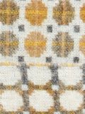 Moon Milan wool throw with abstract circle pattern and fringed edges - British product