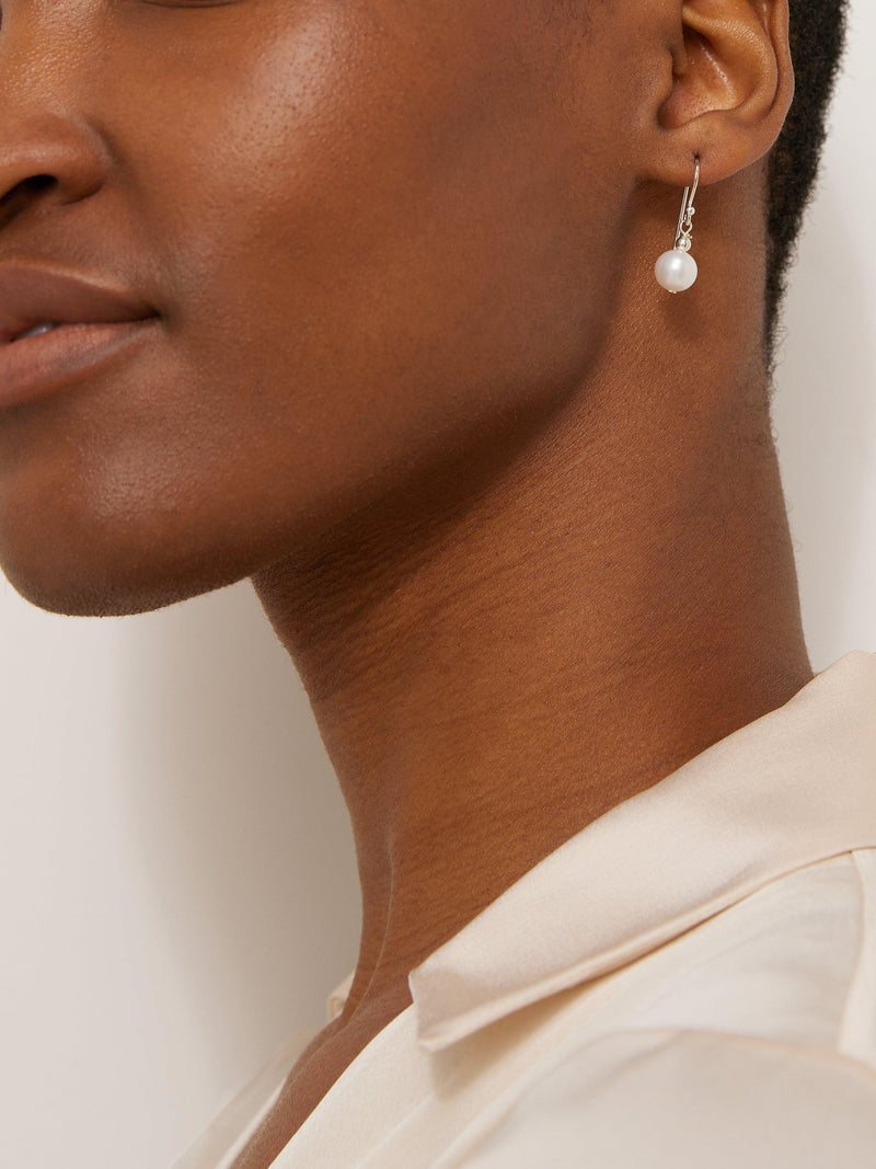 Lido freshwater pearl drop earrings in rhodium plated sterling silver, UK version