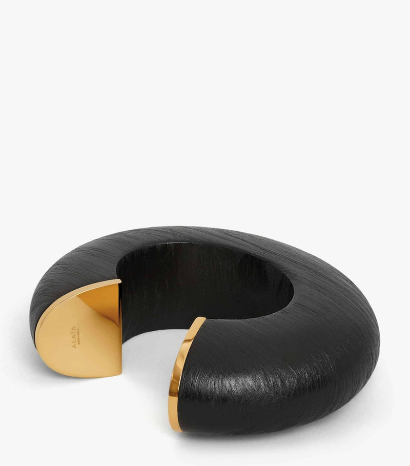 Alaïa wood and brass bumper cuff, imported from the UK