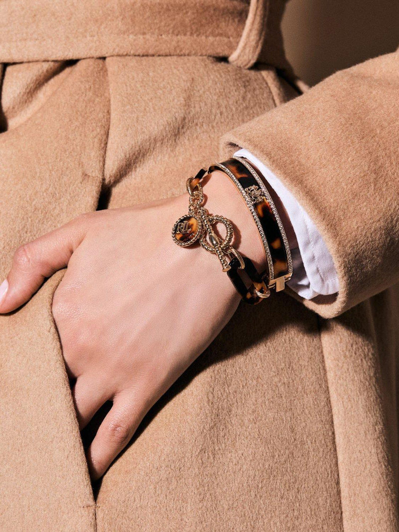 Ralph Lauren gold toned crystal tortoise crest bangle, UK version