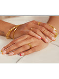Monica Vinader gold bangle with hammered surface - British product