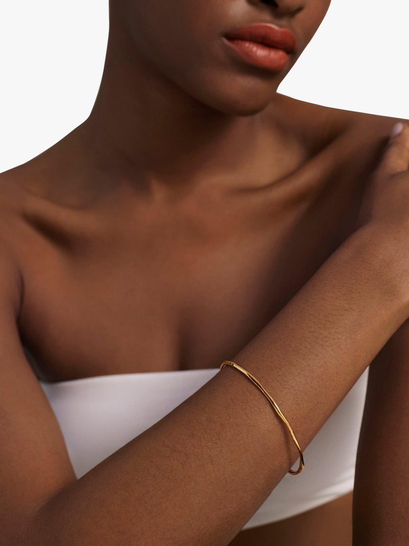 Monica Vinader gold bangle with hammered surface - British product