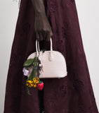Self-Portrait mini leather top-handle bag, imported from the UK