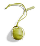 Bottega Veneta green leather tennis ball charm, imported from the UK