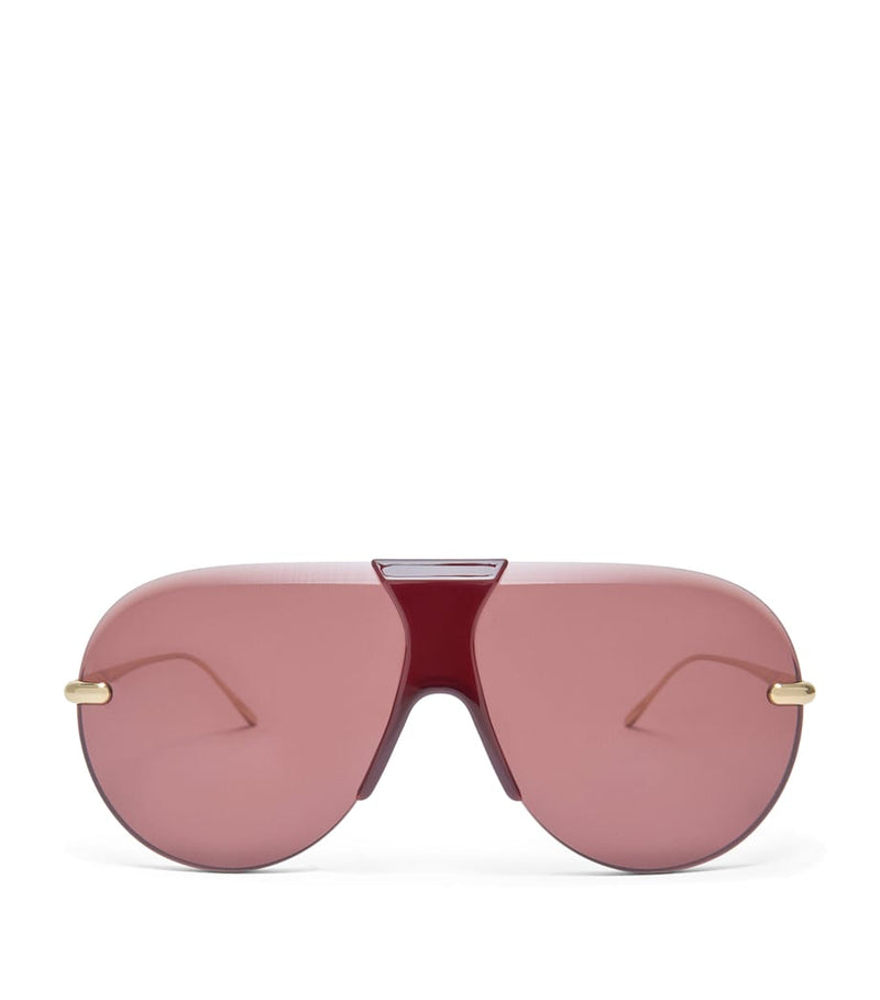 LOEWE aviator sunglasses with red tint and steel frame, imported from the UK