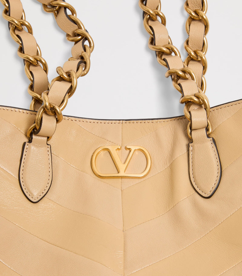 Valentino Garavani small lambskin Laseine tote bag, imported from the UK