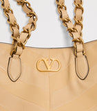 Valentino Garavani small lambskin Laseine tote bag, imported from the UK