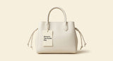 Prada mini leather top-handle bag, imported from the UK