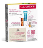 Clarins summer essentials skincare set with radiance drops and lip oil - British product