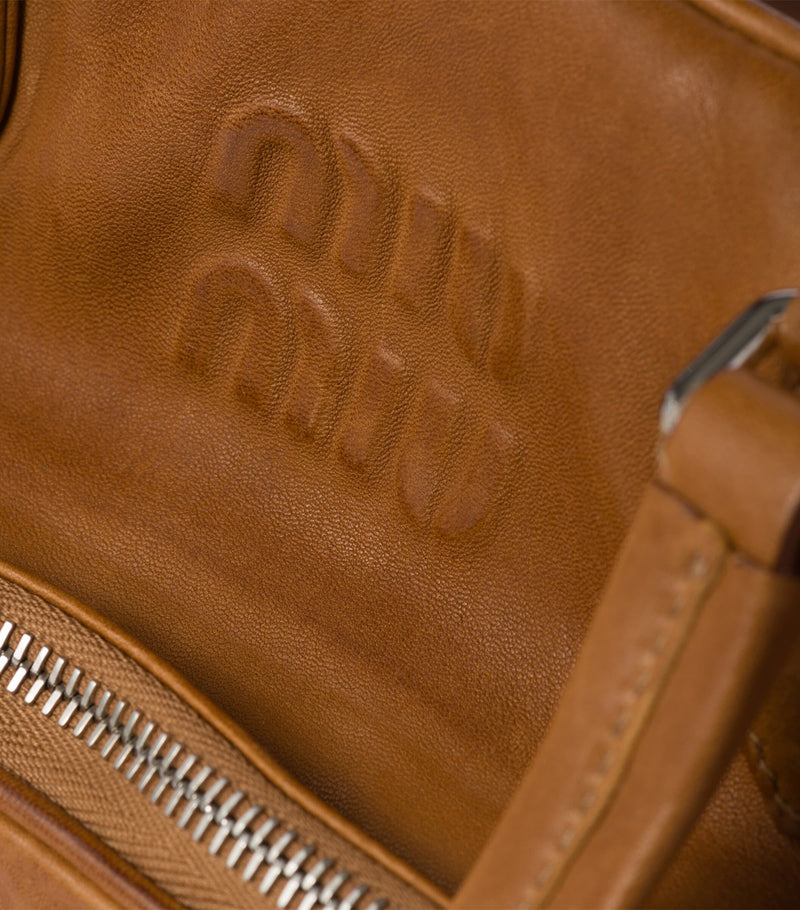 Miu Miu nappa leather top-handle bag with pockets (British brand)