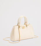 Valentino Garavani VLogo Mini top-handle bag in grained leather (British brand)