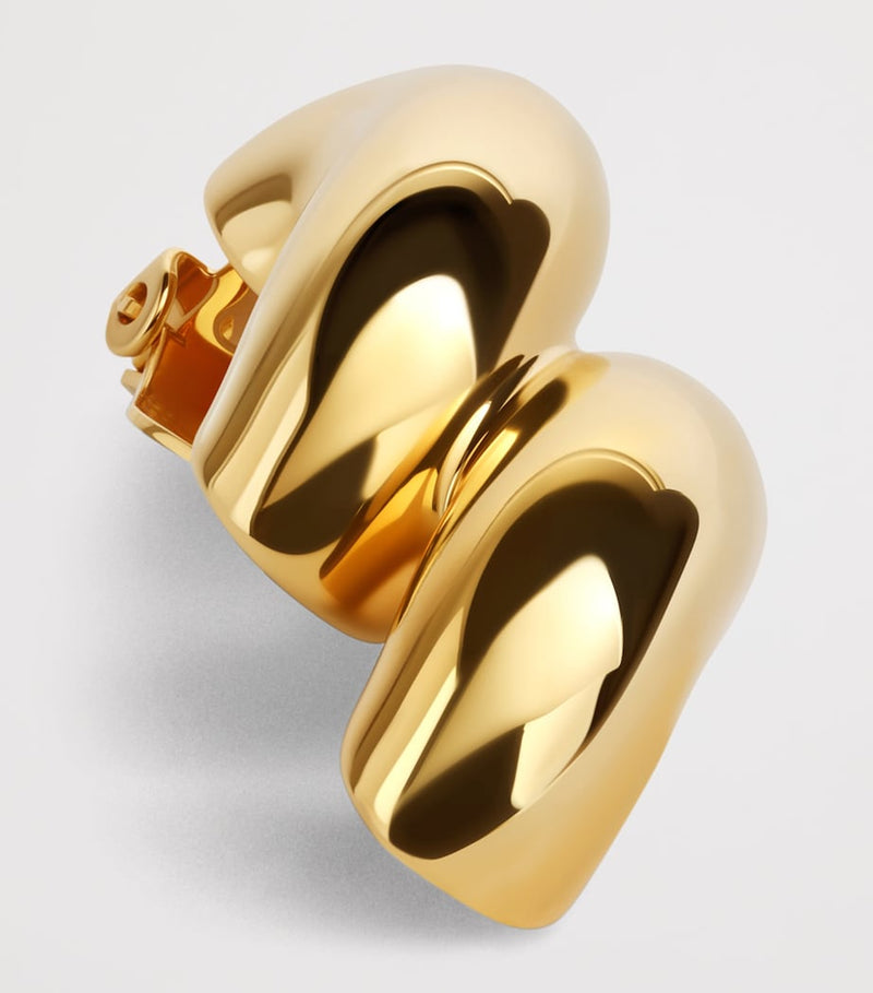 Alaïa Torsion drop earrings brass, imported from the UK