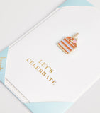 Harrods cake pin badge card with gold-tone lettering (British brand)