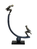 Libra Interiors antique gold bronze balancing act figures sculpture (British brand)