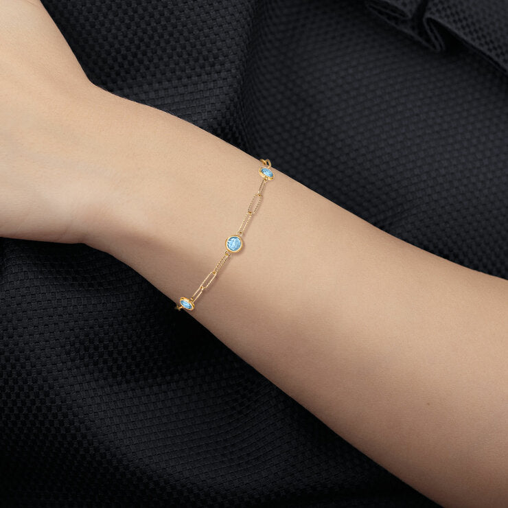 Round cut aquamarine paperclip bracelet 14ct yellow gold, UK version