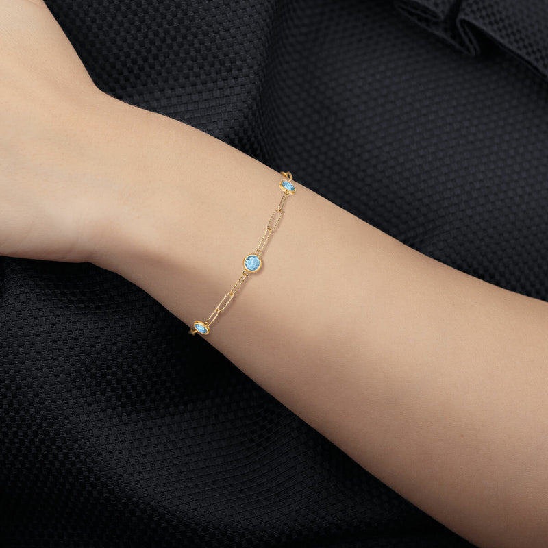 Round cut aquamarine paperclip bracelet 14ct yellow gold, UK version