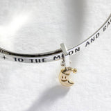 Revere baby bangle with moon and star charm (British brand)
