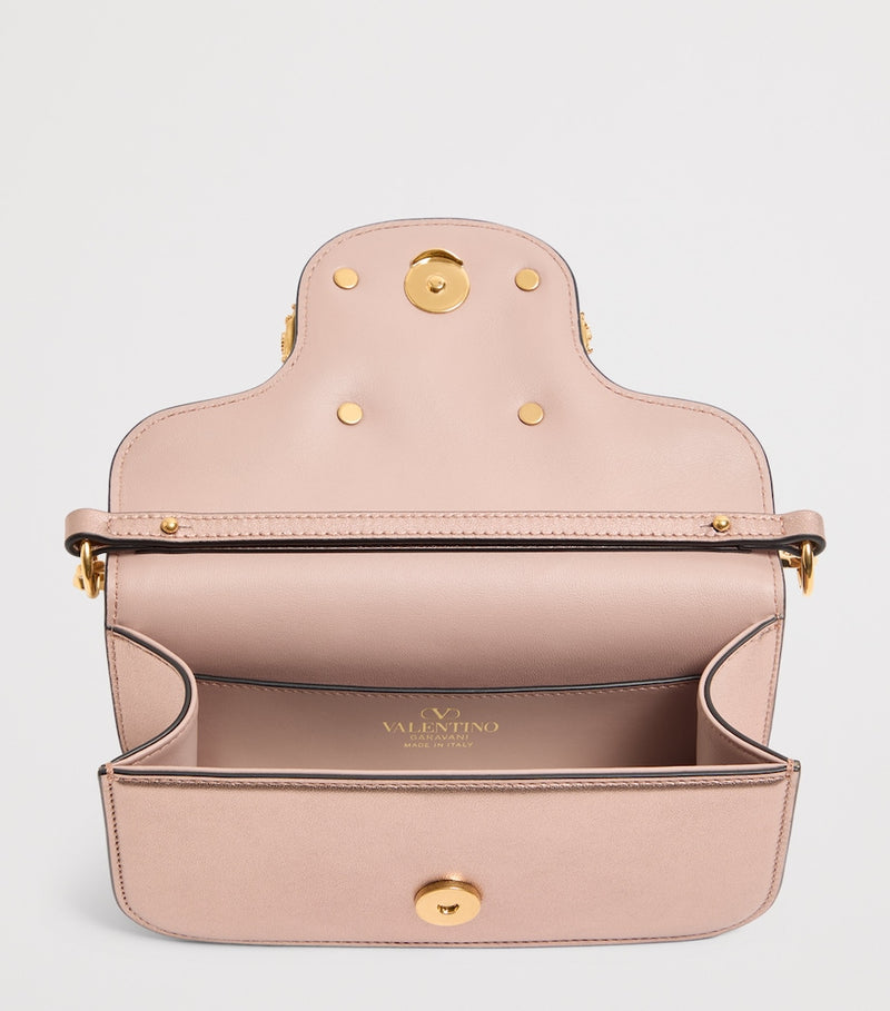 Valentino Garavani Small Leather Locò shoulder bag, imported from the UK