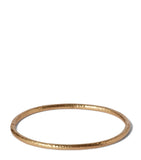 Annoushka yellow gold bangle with hand-hammered finish, imported from the UK