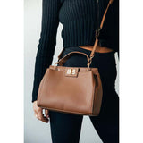 SVNX brown faux leather handbag with gold trim, imported from the UK