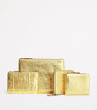 Comme Des Garçons gold embossed leather wallet, imported from the UK