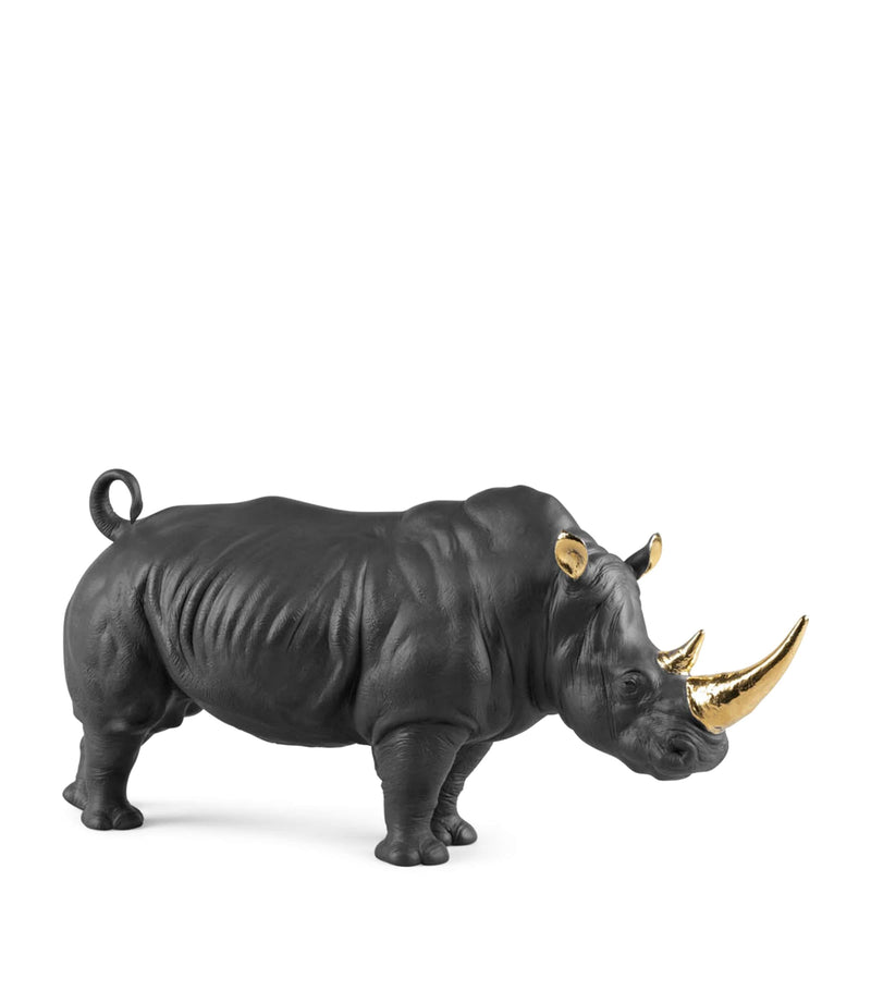 Lladró porcelain rhino figurine with gold accents, 22cm high, UK version