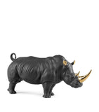 Lladró porcelain rhino figurine with gold accents, 22cm high, UK version