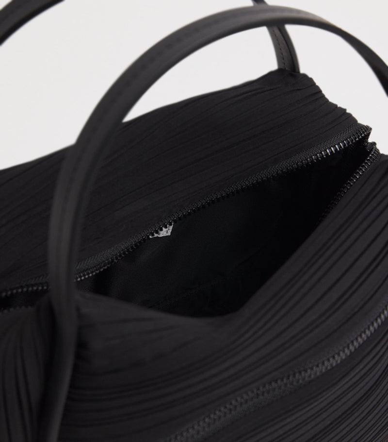 Pleats Please Issey Miyake bias pleats top-handle bag, imported from the UK