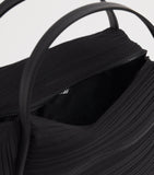 Pleats Please Issey Miyake bias pleats top-handle bag, imported from the UK