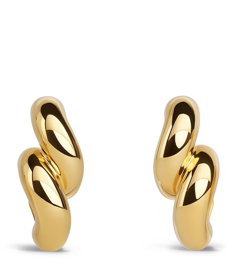 Alaïa Torsion drop earrings brass, imported from the UK