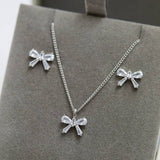 Jon Richard rhodium plated bow earrings and pendant set, UK version