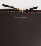Comme Des Garçons large leather exterior pocket wallet, imported from the UK