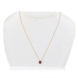 Round cut pink tourmaline pendant in 14ct rose gold (British brand)