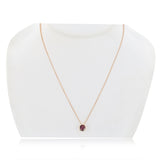 Round cut pink tourmaline pendant in 14ct rose gold (British brand)