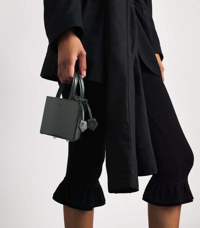 Talel leather triangle top-handle bag - British product