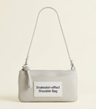 Balenciaga python-embossed calfskin pouch turn-lock closure (British brand)