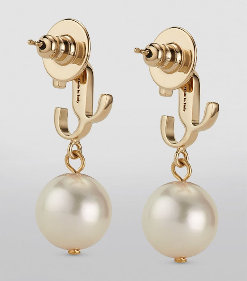 Jimmy Choo pearl earrings with resin pearl and JC monogram, UK version