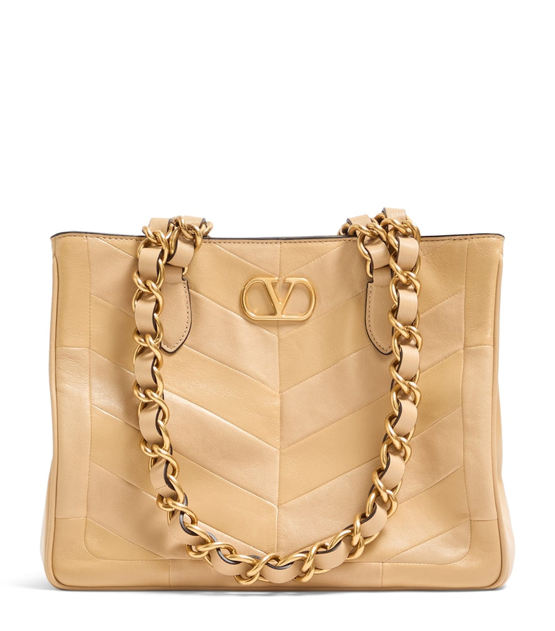 Valentino Garavani small lambskin Laseine tote bag, imported from the UK