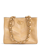 Valentino Garavani small lambskin Laseine tote bag, imported from the UK