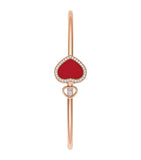Chopard Happy Hearts rose gold bangle with moving diamond and red stone (British brand)