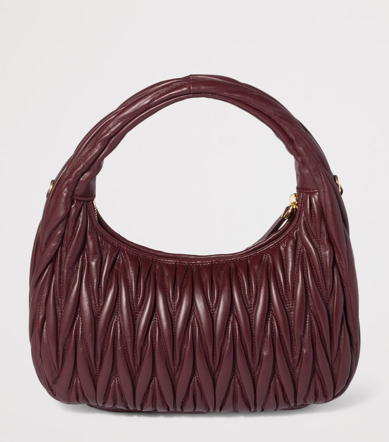 Miu Miu Wander matelassé leather top-handle bag (British brand)