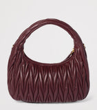 Miu Miu Wander matelassé leather top-handle bag (British brand)